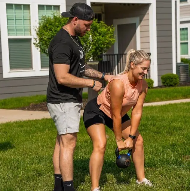muscular man lifting weights in a gym