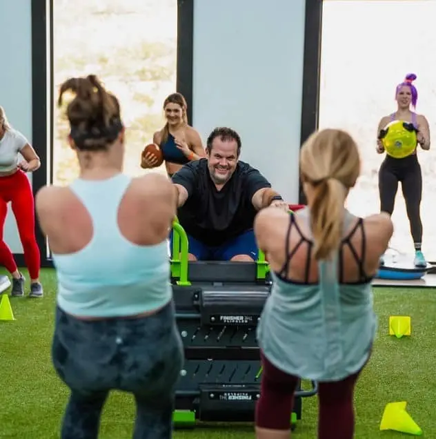 muscular man lifting weights in a gym