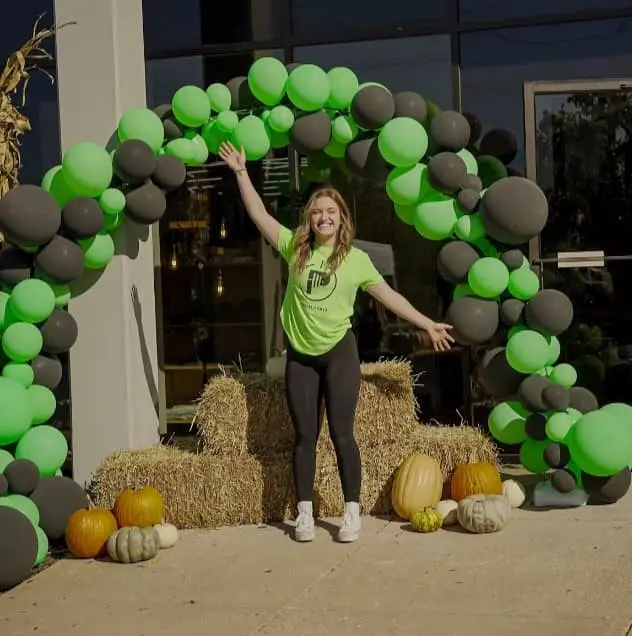 muscular man lifting weights in a gym
